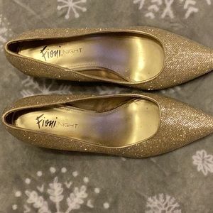 Gold high heel shoes